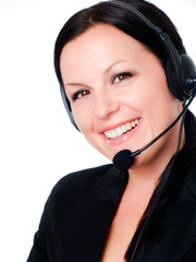 smiling brunette woman talking by headphone