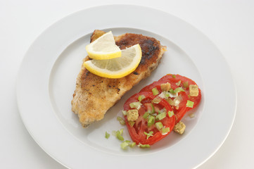 grilled carp fillet with tomato and herbs