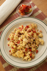scrambled eggs with organic tomato and bacon