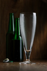 Brown bottle of beer on a black background