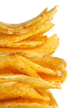 stacked golden popato crisps, isolated on white background