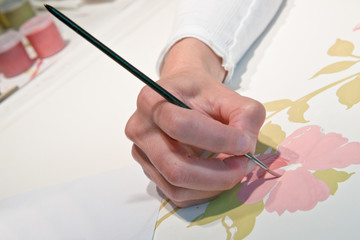 Painting floral design on paper