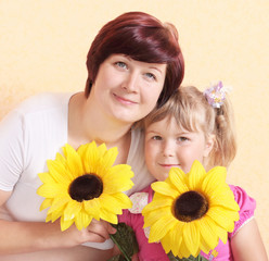 mother and girl with flowers