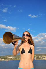 girl shouting into a megaphone
