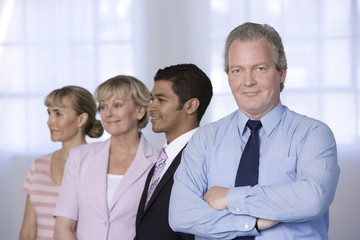 Portrait of businessman and his team.