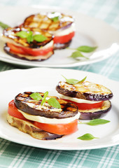 Aubergine towers with mozzarella and tomato