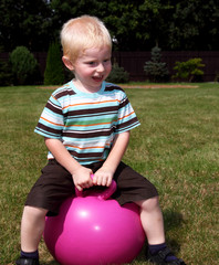 child on a bouncing ball