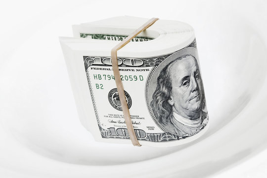 dollars bank notes serve on white plate