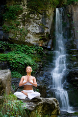 Woman doing yoga in the nature