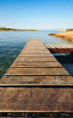 Wooden pier in Greece extending into the sea