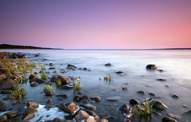 Beautiful coastal sunset. Wide angle photo.