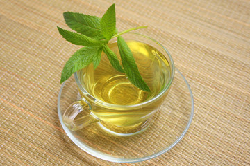 cup of green tea with mint