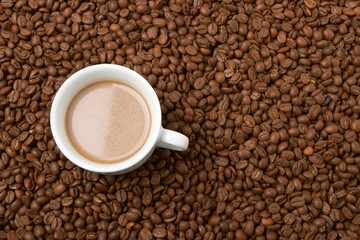 Cup with coffee, costing on coffee grain