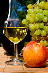 Glass of white wine with  fruits