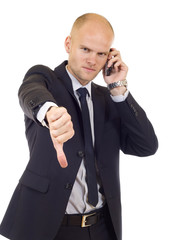 Naklejka premium Businessman with bad news on his cell phone