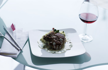 beef steak and a glass of red wine