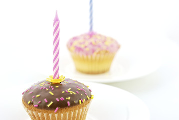 Birthday candle and chocolate muffin