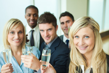 Businesspeople toasting with champagne