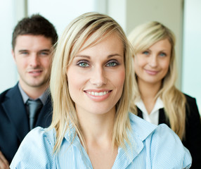 Portrait of a businesswoman in front of her team