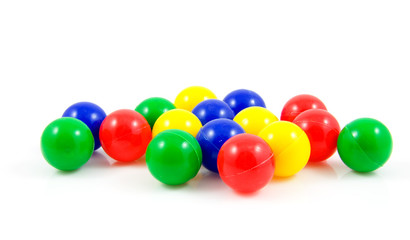 plastic colorful balls over white background