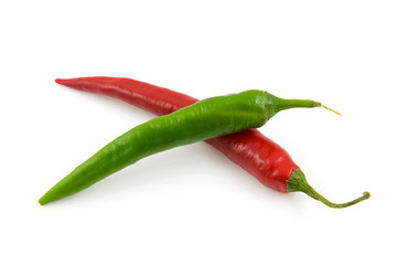 Fresh red and green hot pepper over white background