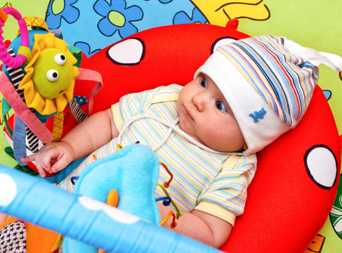 Infant in baby gym