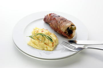 mashed potato and chicken roll on a white plate