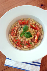 mediterranean noodle soup with white beans and tomato