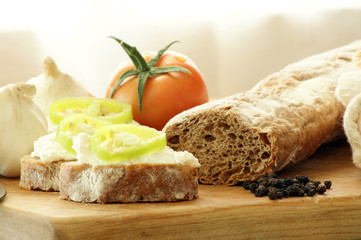 baguette as a snack with cottage cheese and green paprika