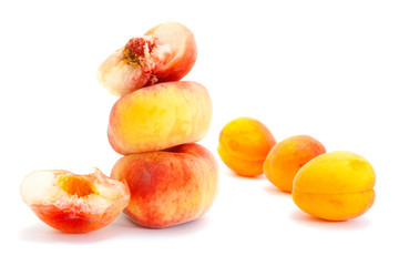 Peaches and apricots isolated on white