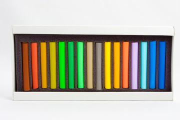 Obraz premium Color chalk in box isolated