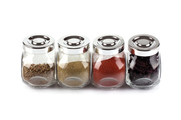 Jars with spices isolated on the white background