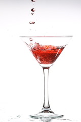 red cocktail on white