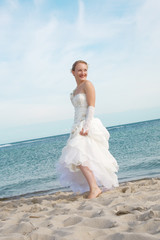 Fototapeta na wymiar Happy bride on the beach