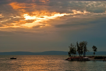 Sunset with lonely boat