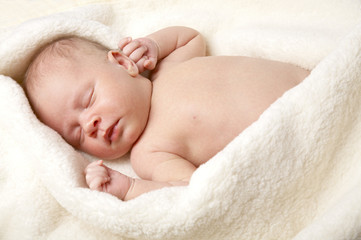 Newborn sweetly sleeps