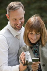 couple holding video camera