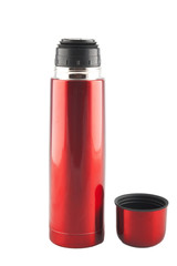 red metal thermos  with cup nearby