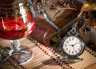 the still life with wine glass and pocket watch