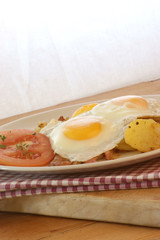 fried egg with organic potato and bacon