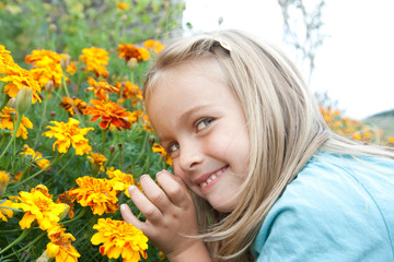 young girl in the garden with a bold glance