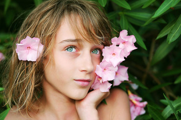 Teen girl with pink flower in her hair