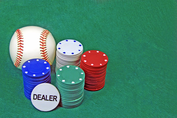 poker chips on a green table and a baseball ball
