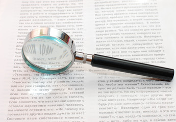 Magnifying Glass and document close up
