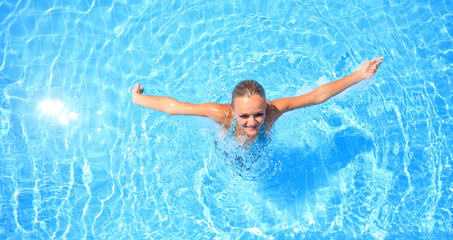 woman enjoying a swimming pool