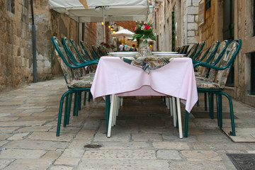 Fototapeta na wymiar A typical European street restaurant in Dubrovnik (Croatia)