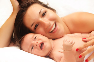 Obraz na płótnie Canvas Happy mom with her baby