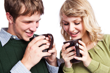 Caucasian couple holding coffee cups