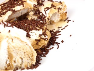 Delicious ice cream with chocolate on white background