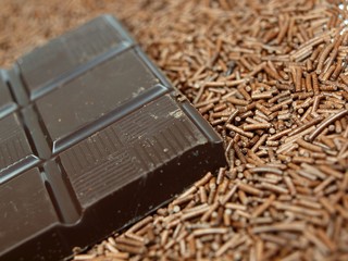 Chocolate bars on chocolate granules background